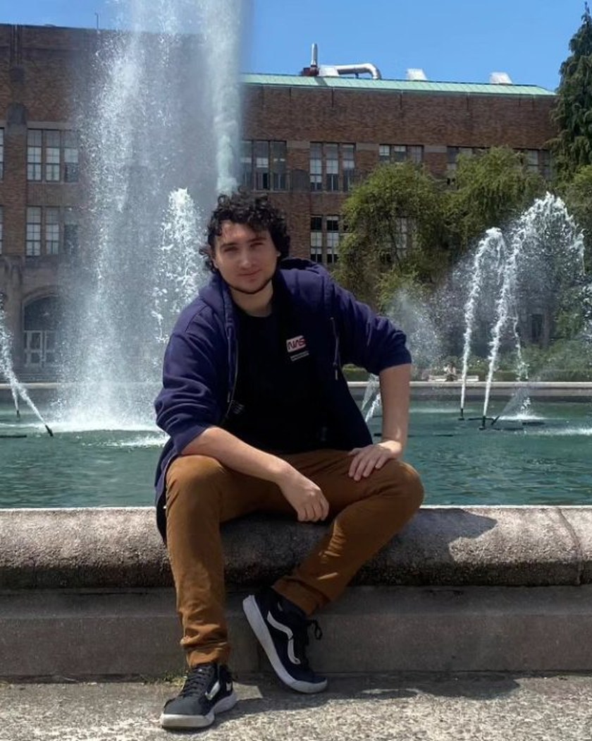 William Harris sitting by a fountain