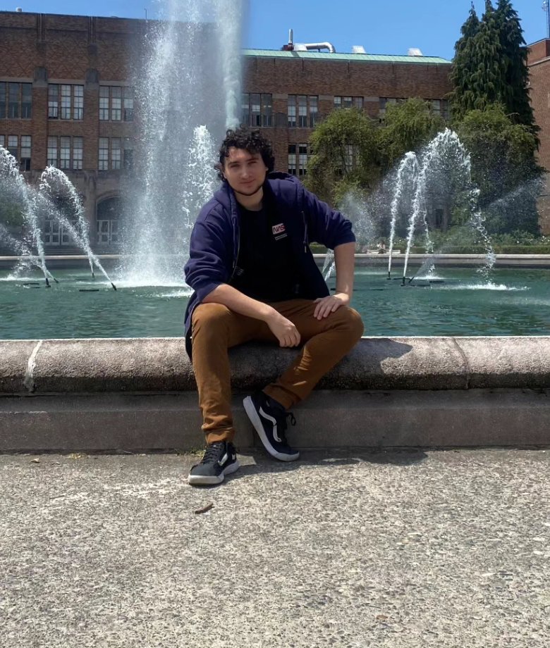 William Harris sitting by a fountain