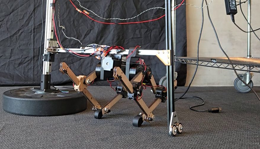 Front view of the bipedal prototype on its boom arm